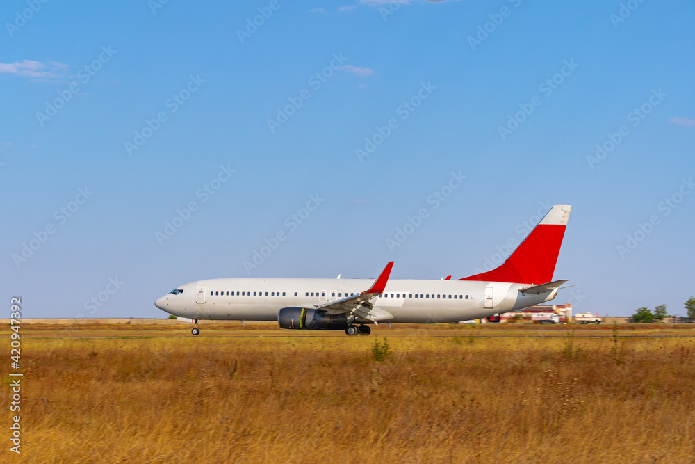Big passenger airplane drives along the runway in airport Big passenger airplane drives along the runway in airport
