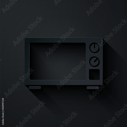 Paper cut Microwave oven icon isolated on black background. Home appliances icon. Paper art style. Vector