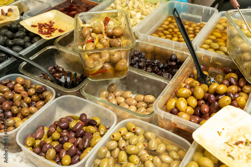 Assortment of Olives being sold at a traditional farmers street market