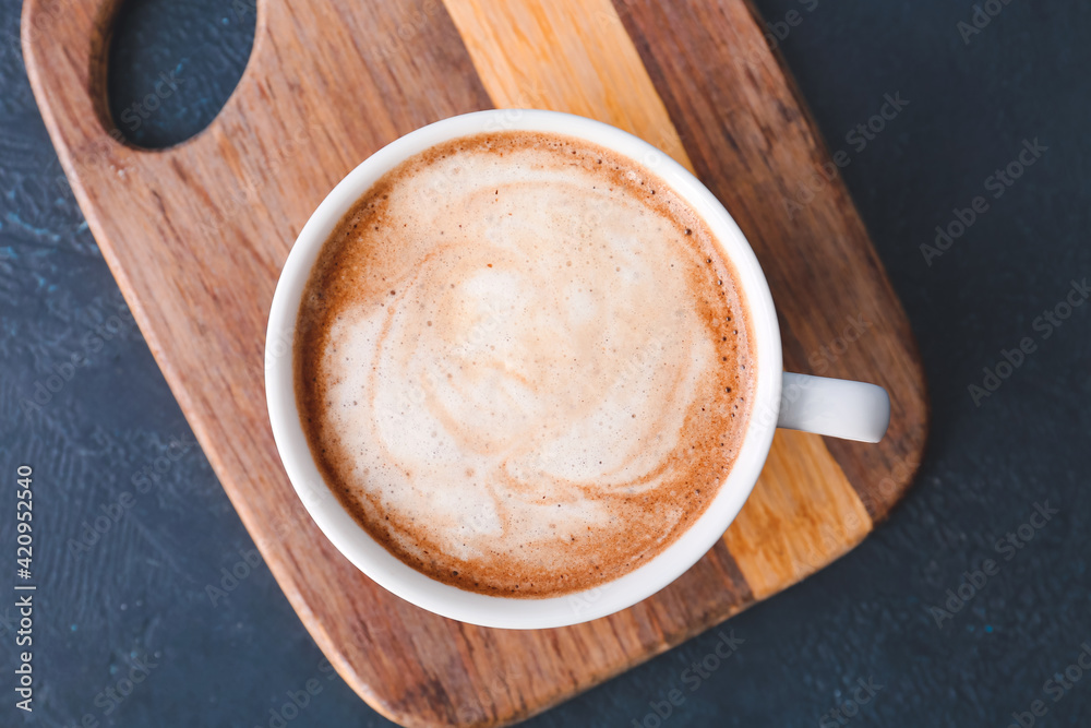 Cup of tasty latte on dark background Cup of tasty latte on dark background