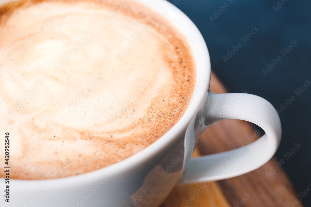 Cup of tasty latte on dark background Cup of tasty latte on dark background