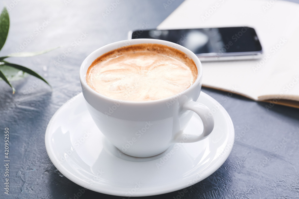 Cup of tasty latte on dark background Cup of tasty latte on dark background