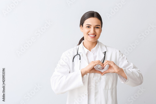 Cardiologist making heart w...