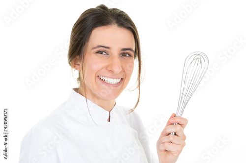 Portrait of woman young chef with pastry whip on white background