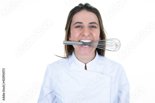 Woman chef funny happy with a mixer hand in her mouth on white background