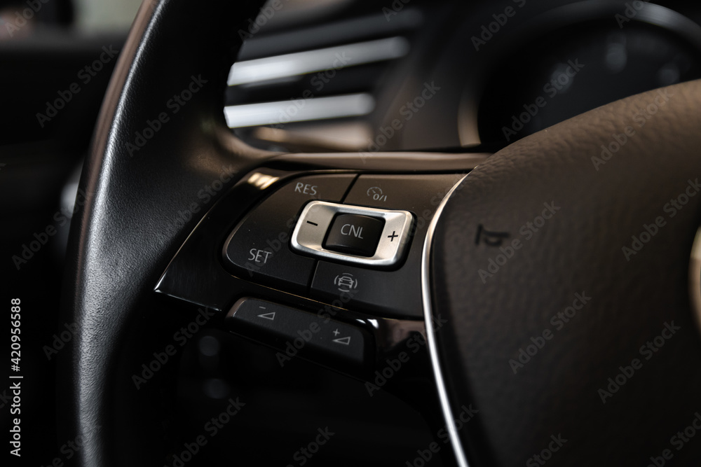 Steering wheel details and steering wheel controls. Leather-wrapped Steering wheel. 