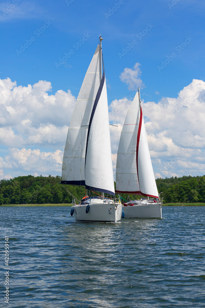 Lake in Polish Masuria, sailing yachts on a sunny day, Masuria, Poland