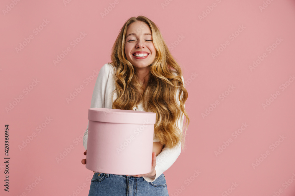 Beautiful happy young blonde woman isolated over pink Beautiful happy young blonde woman isolated over pink