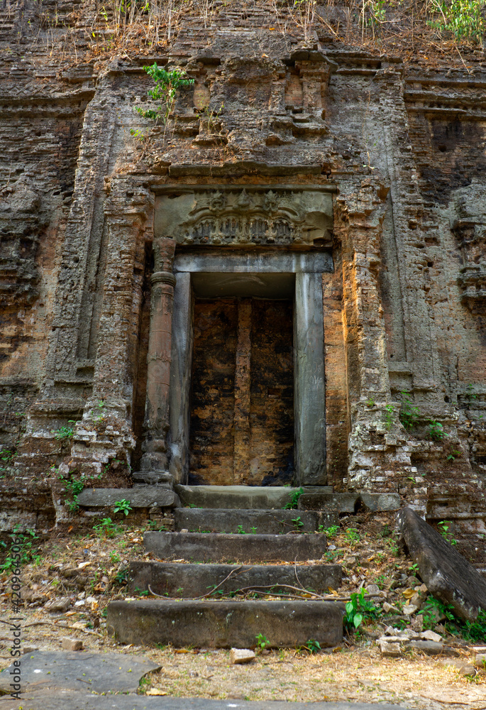 Ruins of goal kampong tom Wat Temple with root of trees in forest Cambodia. Ruins of goal kampong tom Wat Temple with root of trees in forest Cambodia.