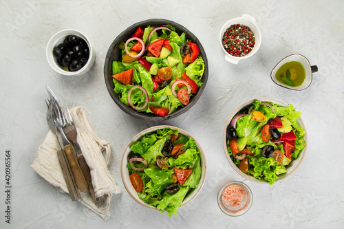 Fresh vegetables salad on light gray background. Healthy eating concept.