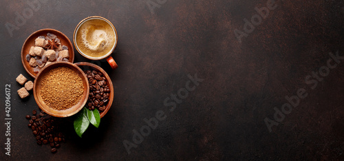 Roasted coffee beans, ground powder and espresso cup