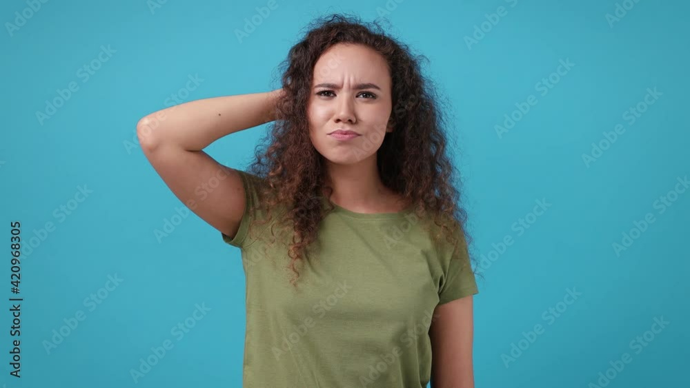 Proactive insighted young african american woman 20s in green khaki t-shirt posing isolated on blue background in studio. People lifestyle concept. Hold index finger up with great new idea thumbs up Proactive insighted young african american woman 20s in green khaki t-shirt posing isolated on blue background in studio. People lifestyle concept. Hold index finger up with great new idea thumbs up