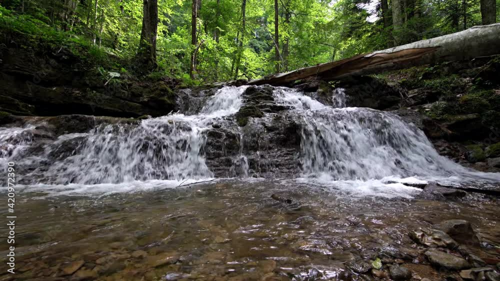 Beautiful waterfall on the river in the forest Beautiful waterfall on the river in the forest
