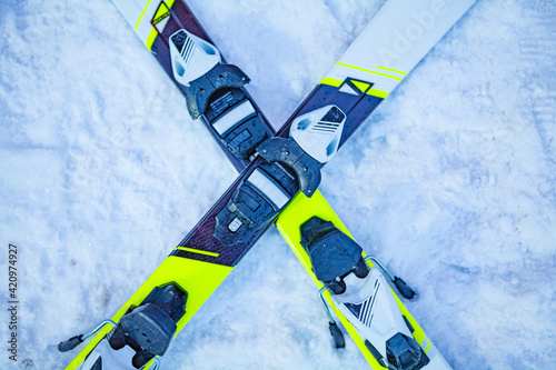 Skis on snow in the form of cross