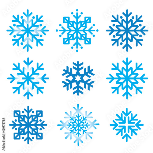 Snowflakes, abstract icons set.  Illustration of nine blue decorative snowflakes inspired of folk art. © jiris
