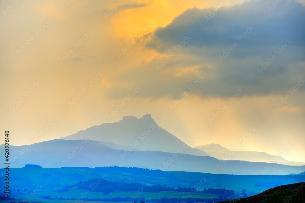 SPECTACULAR DRAKENSBERG SKIES. Late afternoon sun illuminates  cloud formations and plays across the dramatic landscape 