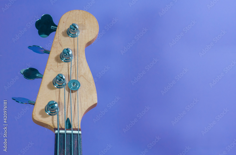 bass guitar headstock with tuning knobs, truss rod, bass strings
