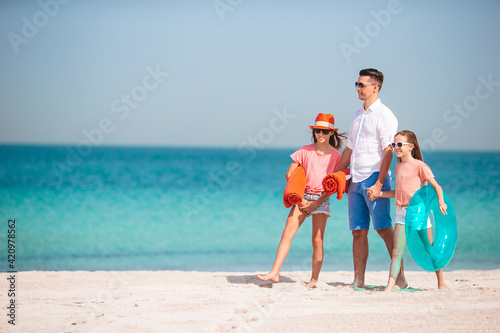 Portrait of family in summer on the seashore © travnikovstudio