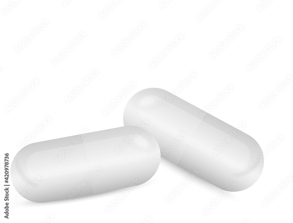 white capsules lying on a white background