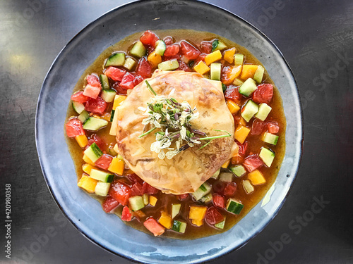 Crispy vegetable tourt with spicy tomato  juice.