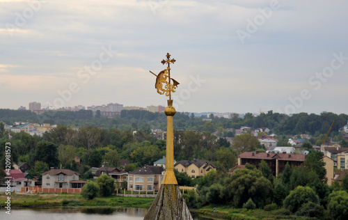 View from observation deck of belfry of Transfiguration (Spaso-Preobrazhensky) Monastery on spire with coat of Holy Gates, city and Kotorosl River, Yaroslavl, Russia photo