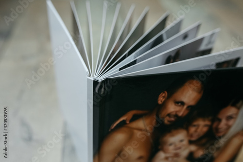 example of a family photo book, high-quality photo print, spread of the book, store memories beautifully in a family album