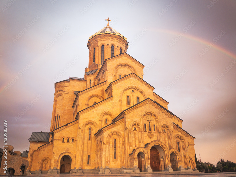 Panoramic view Tbilisi holy trinity cathedral with rainbow background