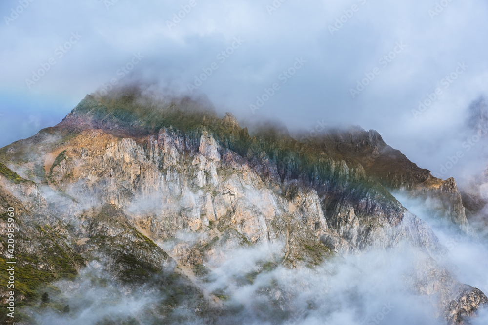 Misty mountains and rainbows in the early morning