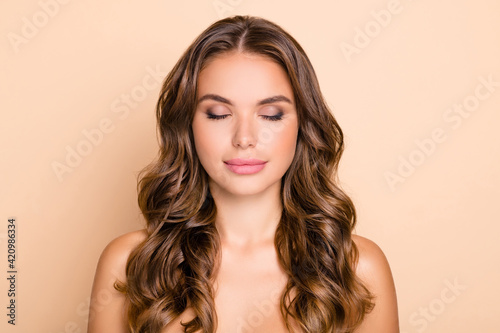 Photo of nice long hairdo optimistic lady without clothes closed eyes isolated on pastel beige color background