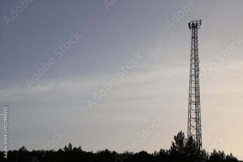 Antenna Telephone Network Communication Cable with Sunset Background