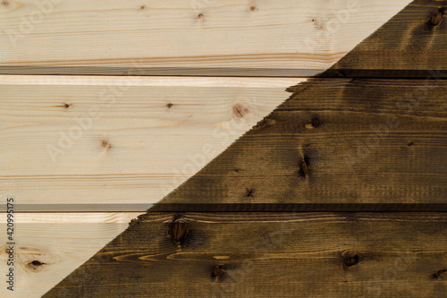 Wooden surface made of horizontal planks. Highlight half diagonally. Wood color - Grain Brown, Mikado, Hue Brown. Comparison light-dark background concept.