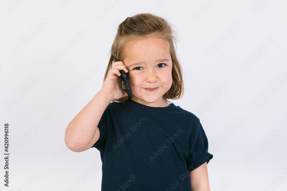 Little blonde girl talking on her mobile phone Little blonde girl talking on her mobile phone