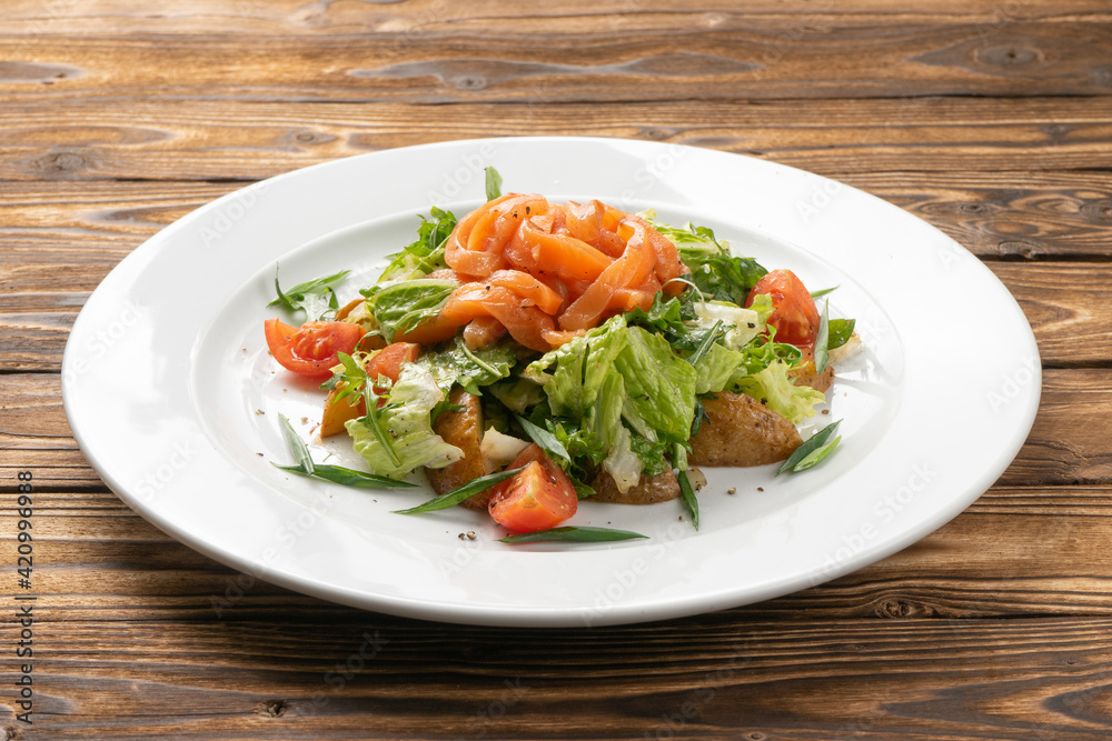 Vegetarian vegetable salad with salmon, potatoes and cherry tomatoes Vegetarian vegetable salad with salmon, potatoes and cherry tomatoes