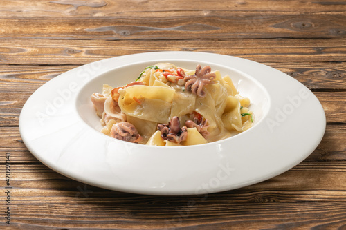 Pappardelle pasta with octopus and bacon