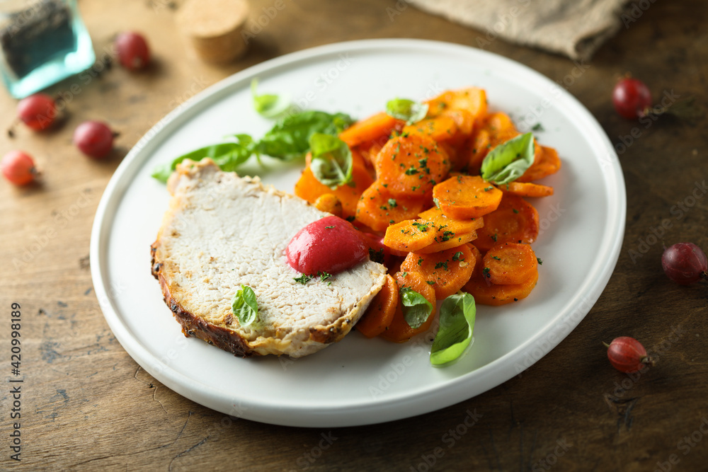Homemade roasted pork with carrot and gooseberry sauce