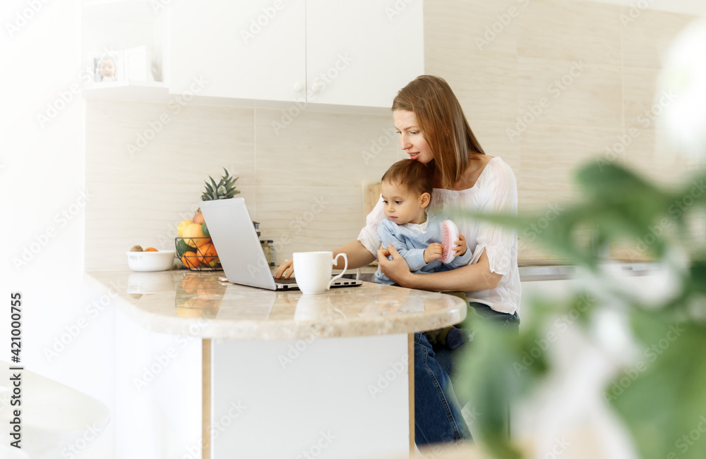 young woman with baby using laptop . Blogger, writer, journalist, student girl working on computer at home. Businesswoman, work from home, distance education, online learning, studying concept young woman with baby using laptop . Blogger, writer, journalist, student girl working on computer at home. Businesswoman, work from home, distance education, online learning, studying concept