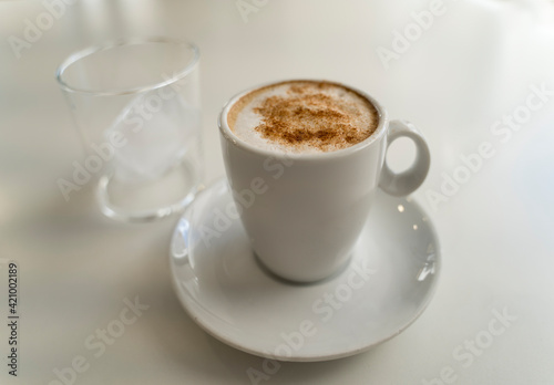 cup of coffee on white table