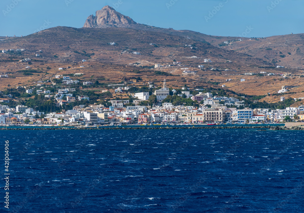 Panorama view of chora Tinos with the  traditional white houses and the famous spiritual center Panagia Tinos monastery  in  Tinos island, cyclades, Greece.