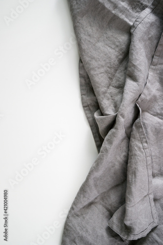 mocap white background crumpled gray linen napkin linen texture. table setting modern style minimalism rustic. background for an inscription. drapery and folds. tablecloth. photo