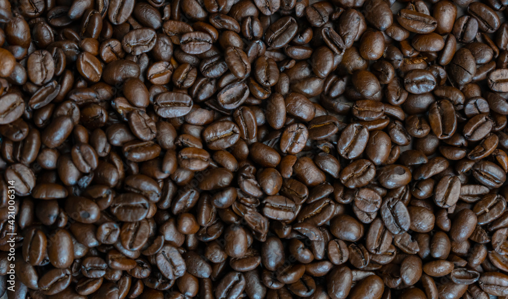 Roasted coffee beans background.Top closeup view. Roasted coffee beans background.Top closeup view.