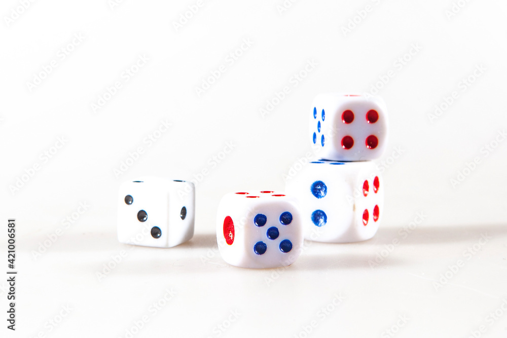 Multicolored gambling dices isolated on the white background Multicolored gambling dices isolated on the white background