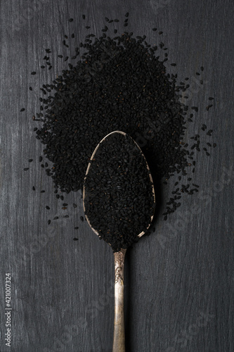 Black cumin seeds in spoon