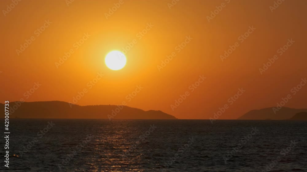 Beautiful red sunset on background of sea water and mountains. Beautiful red sunset on background of sea water and mountains.