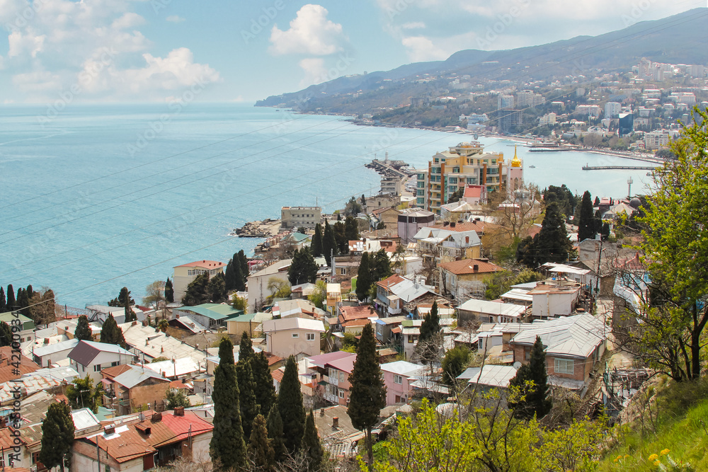 The city of Yalta and the panorama of the Crimean mountains, from the top of the hill.