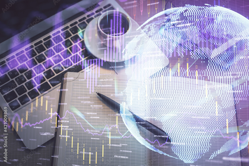 Obraz premium Stock market graph and top view computer on the table background. Multi exposure. Concept of financial education.
