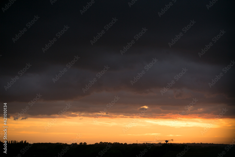 Orange sunset with silhouetted skyline Orange sunset with silhouetted skyline