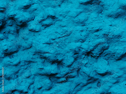 Rough textured dark cosmic turquoise blue matte abstract stone with relief background. Wall. Old paint © SymbiosisArtmedia