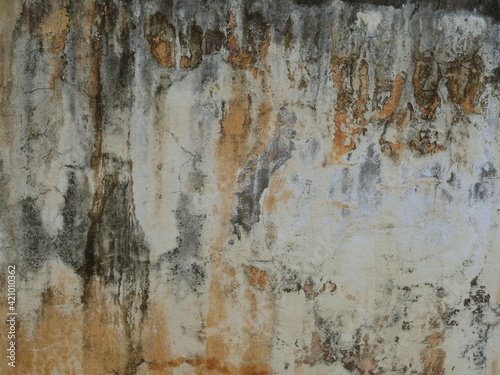 Old cement or concrete outdoor wall with stains and moldy for background. © sainan