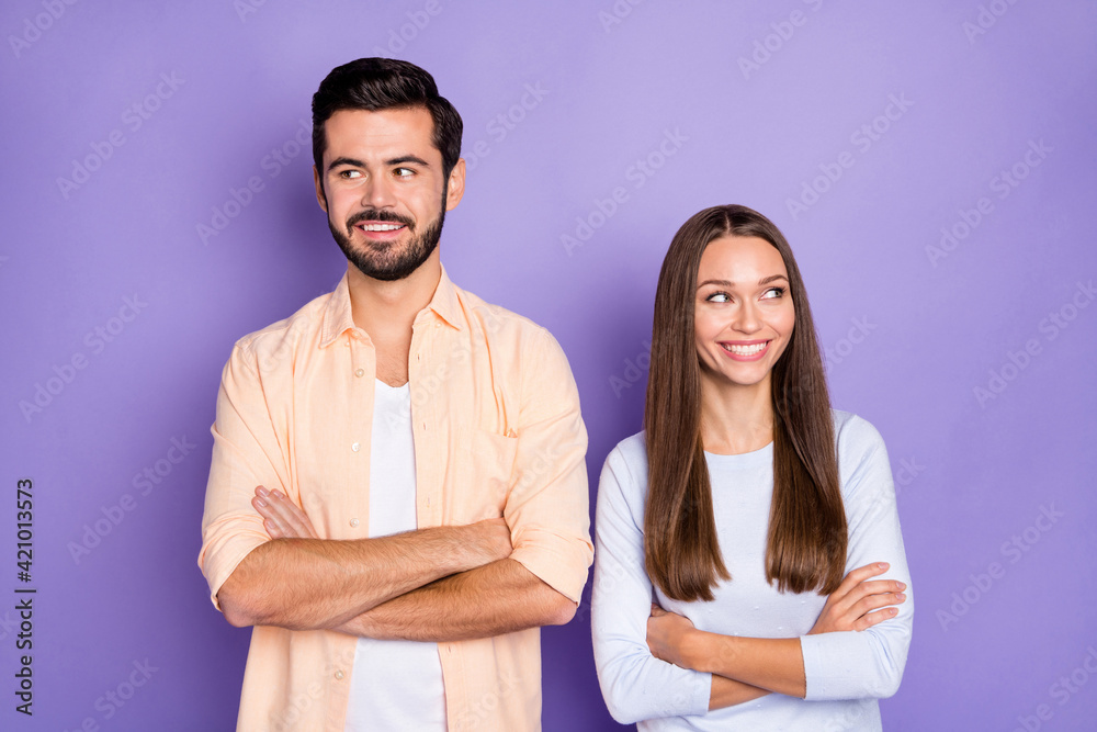 Portrait of cheerful man lady folded arms look empty space toothy smile isolated on purple color background Portrait of cheerful man lady folded arms look empty space toothy smile isolated on purple color background