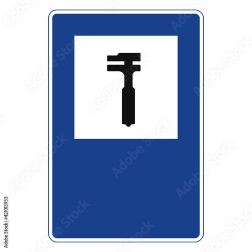 Rectangular traffic signal in blue and white, isolated on white background. Car repair workshop